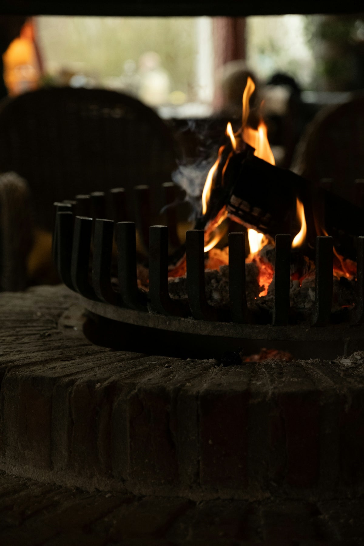 A close up of a fire in a brick oven