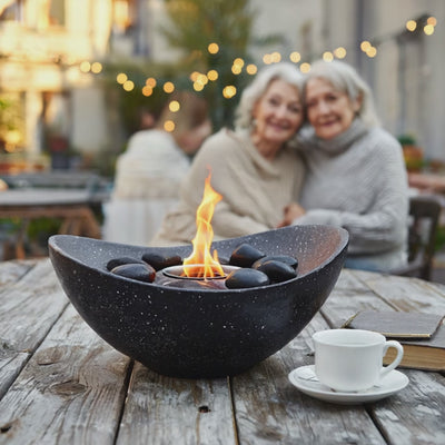 Elderly women enjoying a cozy evening outdoors with a flickering tabletop bio ethanol fireplace on a rustic wooden table, surrounded by warm string lights.